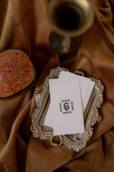 Gaia Florals business cards on a vintage gold tray