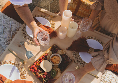 Let's Picnic Co. - Tablescape with burnt orange highlights, candles, and other decor