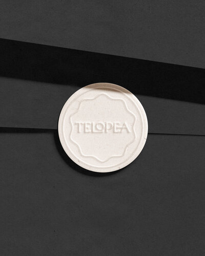 A compact mirror branded with the Telopea Beauty Supplies logo, showcasing the brand’s attention to detail and commitment to elegant, functional beauty accessories.