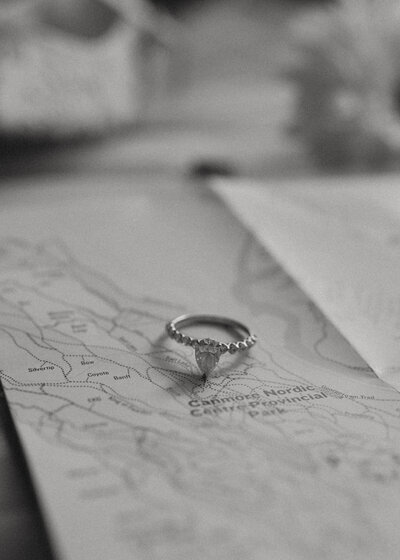 Storytelling Photo of Engagement Ring on Map Canmore, Alberta