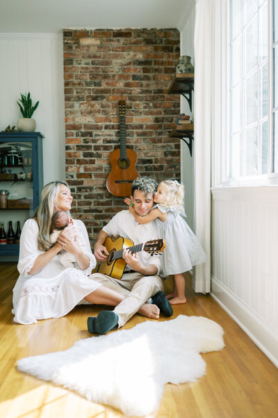 Nashville mom and two sons smiling in bedroom photo shoot