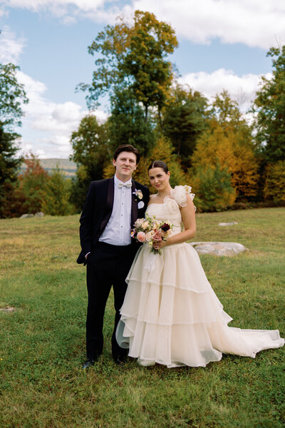 stunning bride and groom formal portrait outside in new england