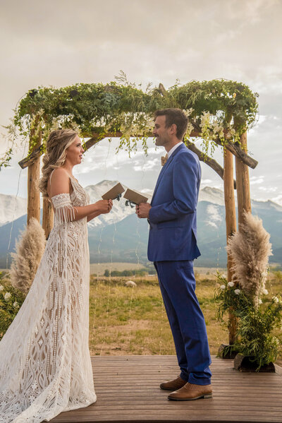 Couple sharing wedding vows in Buena vista