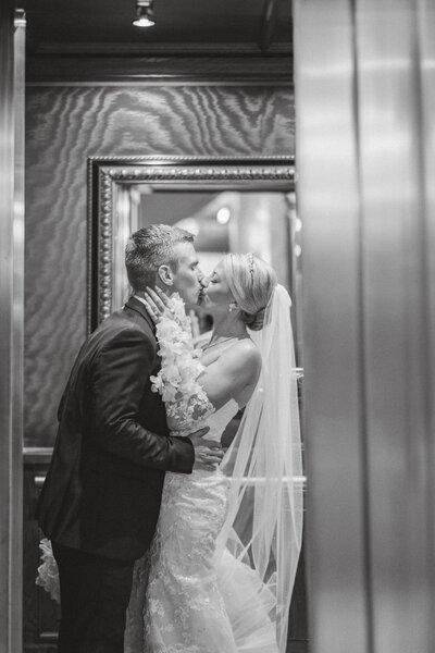 bride embraces her groom with the most cheerful smile right after they tie the knot elegant colorado wedding photographer kari joy photography