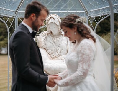 a Catholic couple praying on their wedding day