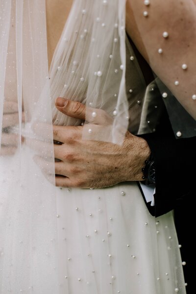 Bride and groom embracing