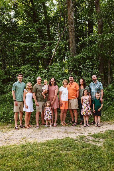 Extended family standing together by the trees - Park Rapids, Minnesota