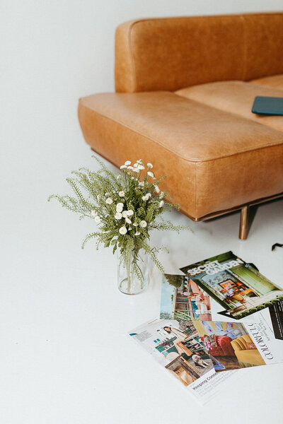 studio session in minnesota with leather couch and magazines