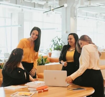 Idit Sharoni and her team of experts discussing sessions in her counseling office. Contact a couples therapist to begin online couples therapy, marriage counseling, and other services.