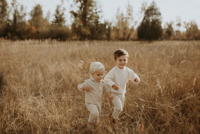 photo of family playing in an open field in montana