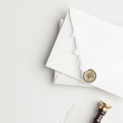 White stacked envelopes - Brenda Chadambura