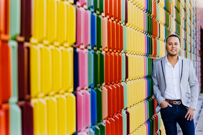 Architect standing in front of a colorful wall in Wynwood Miami Fl