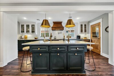 Kitchen island with bar height seating in this three-bedroom, two-bathroom vacation rental home featured on Chip and Joanna Gaines' Fixer Upper located in downtown Waco, TX.