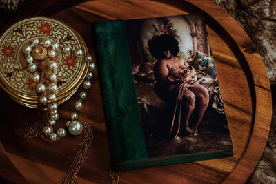 Green velvet luxury boudoir album with an acrylic photo cover.