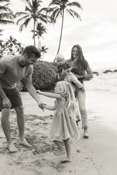 A documentary photo of an expecting couple and their ultrasound photos at the University of VA in Charlottesville