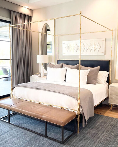 A bedroom interior design project by high-end interior designers in Frisco, featuring elegant accessories and a professionally curated space.