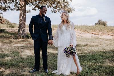 Destination Wedding Photographer captures bride and groom holding hands at Cancun wedding