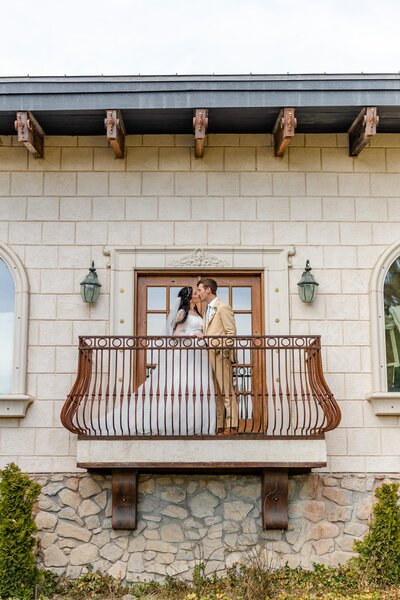 bride and groom wedding portrait on balcony