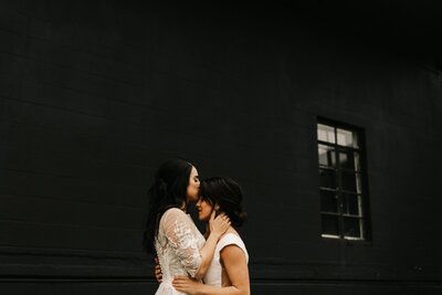 Nashville Tennessee same sex couple elopement in a wearhouse in flowy white lace wedding dresses-51150