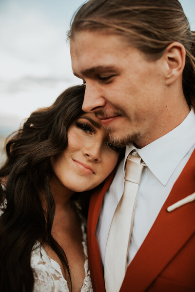 happy couple embracing at after their Utah wedding