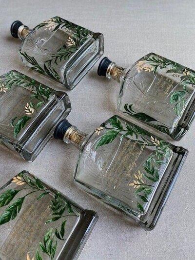 5 rum bottles hand painted and engraved for brand event in london 