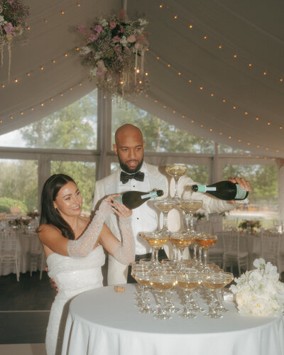 bride and groom smiling at the camera