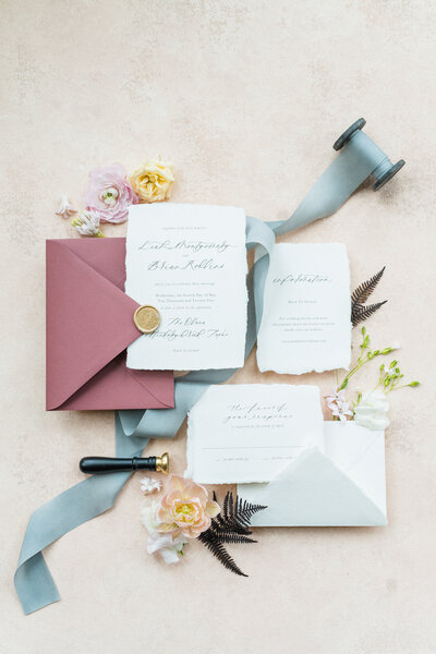 High end wedding invitation suite styles with blue silk ribbon and stunning florals