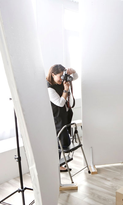 Photographer taking photos in studio in Buffalo, New York