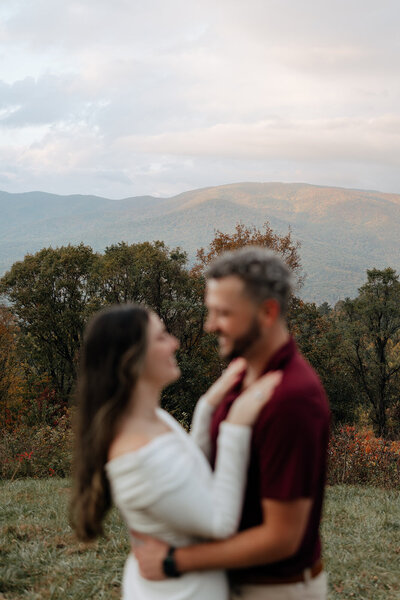 Couple pose during their couples fall photoshoot at Arabia Mountain.