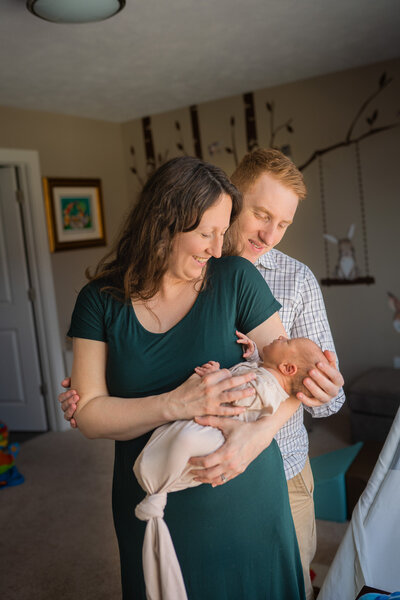 dad holding newborn son