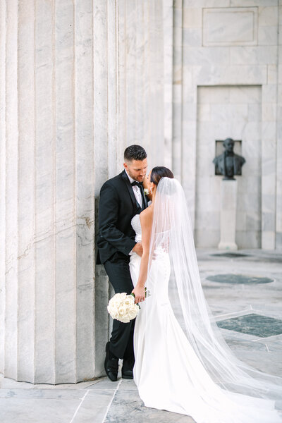 bride and groom holding eachother