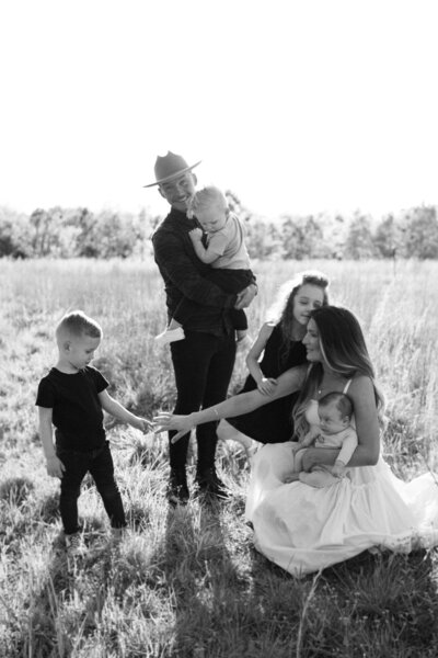 Natural family photos in a gold grassy field in charlotte north carolina