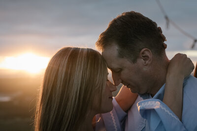 A heartfelt moment between a couple at sunset, captured in an editorial style by San Antonio luxury photographer Chelsea of CMH Studios.