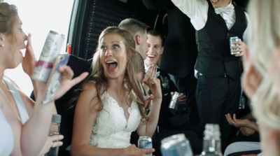 Bridal party celebrates with a cheers at the wedding