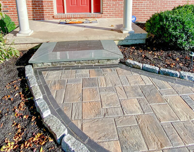 Close up photo of the details of paver steps and walkway with a border