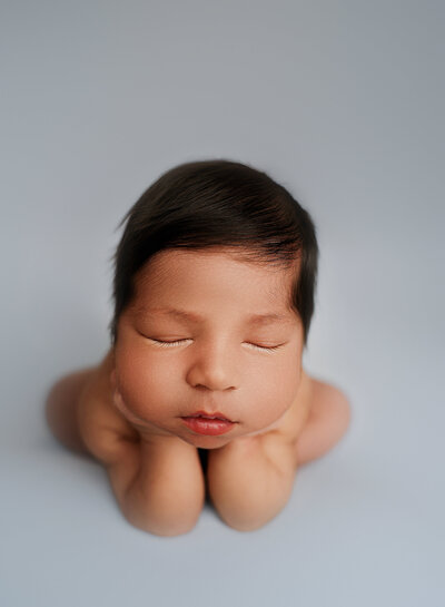 Syracuse photographer, newborn, baby, props, newborn photoshoot, photography, belly, baby blue backdrop, studio, newborn photos near me
