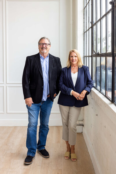 WLS Interests leadership team members Bill Sisson and Stacy Meza standing together, representing the company’s decades of experience, strong operational management, and commitment to serving residential and commercial communities nationwide.