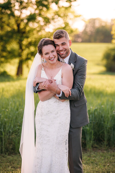 bride and groom having first dance at sunset at Five Dollar Farm wedding Venue in Rock Spring GA