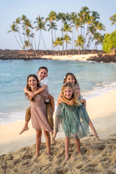 family portrait on beach by Big Island family photographer