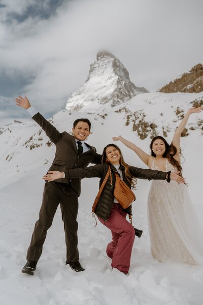 photographer posing with couple