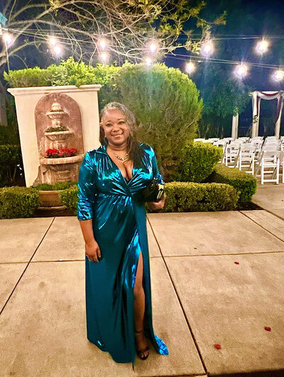 Letitia Hopkins dressed beautifully at a wedding, radiating confidence, self-love, joy, and Main Character Energy, embodying the transformation she helps women achieve as a life, love, and relationship coach.
