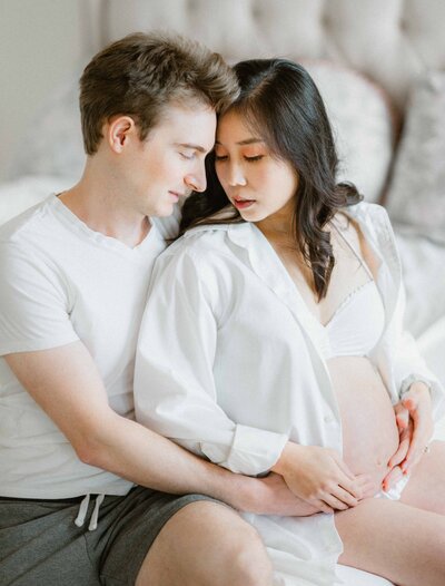 pregnant woman and her husband portrait in-home session dmv maternity photo