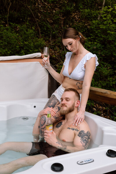 Bride holding up a bouquet of flowers during a beach elopement in Michigan.