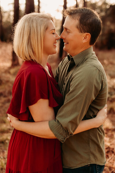 Couples photography near Dayton TX - couple hugging outdoors during romantic session