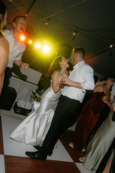 bride posing with back against camera