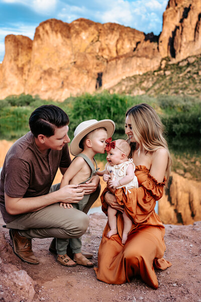 family holding eachother in the desert