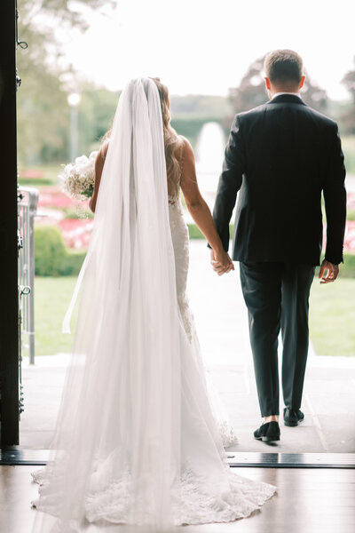 Bride and groom walk up memorial steps at their DC wedding