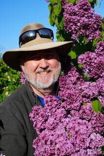 Will smiling and standing next to Etna heirloom lilac