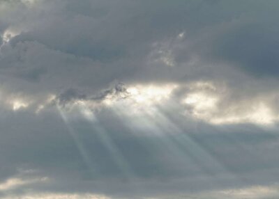 Rays of sun peeking through clouds