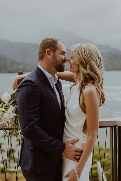 Couple stands on balcony at 1-Hotel Hanalei in Kauai